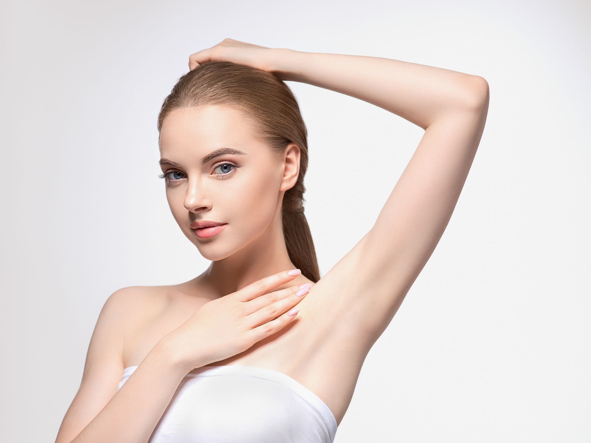 a man without a shirt is standing with his hands on his hips