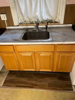 A Kitchen Sink With Wooden Cabinets — Philadelphia, PA — Edward Hughes & Son