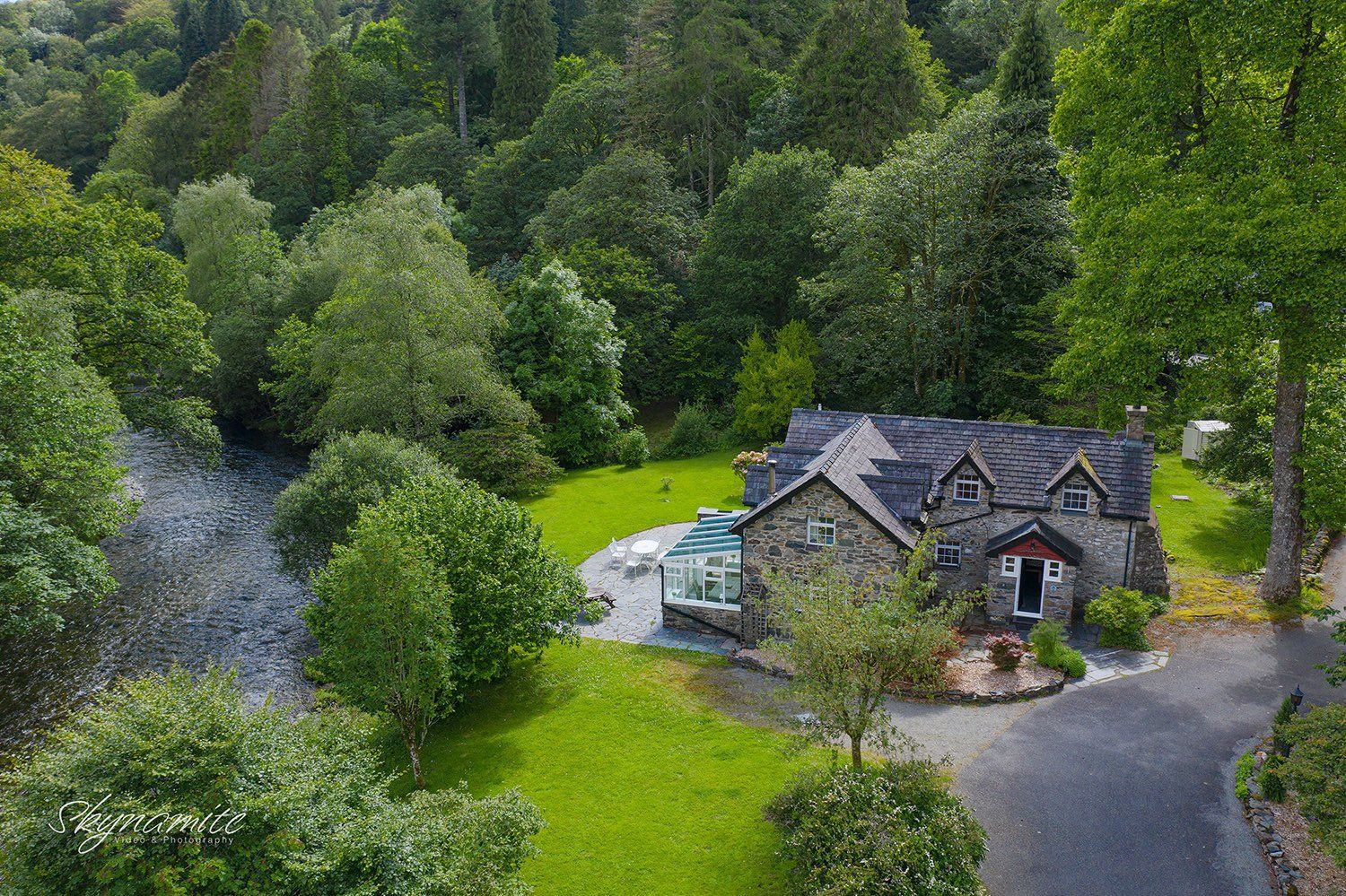 Drone photography of house close to a river.
