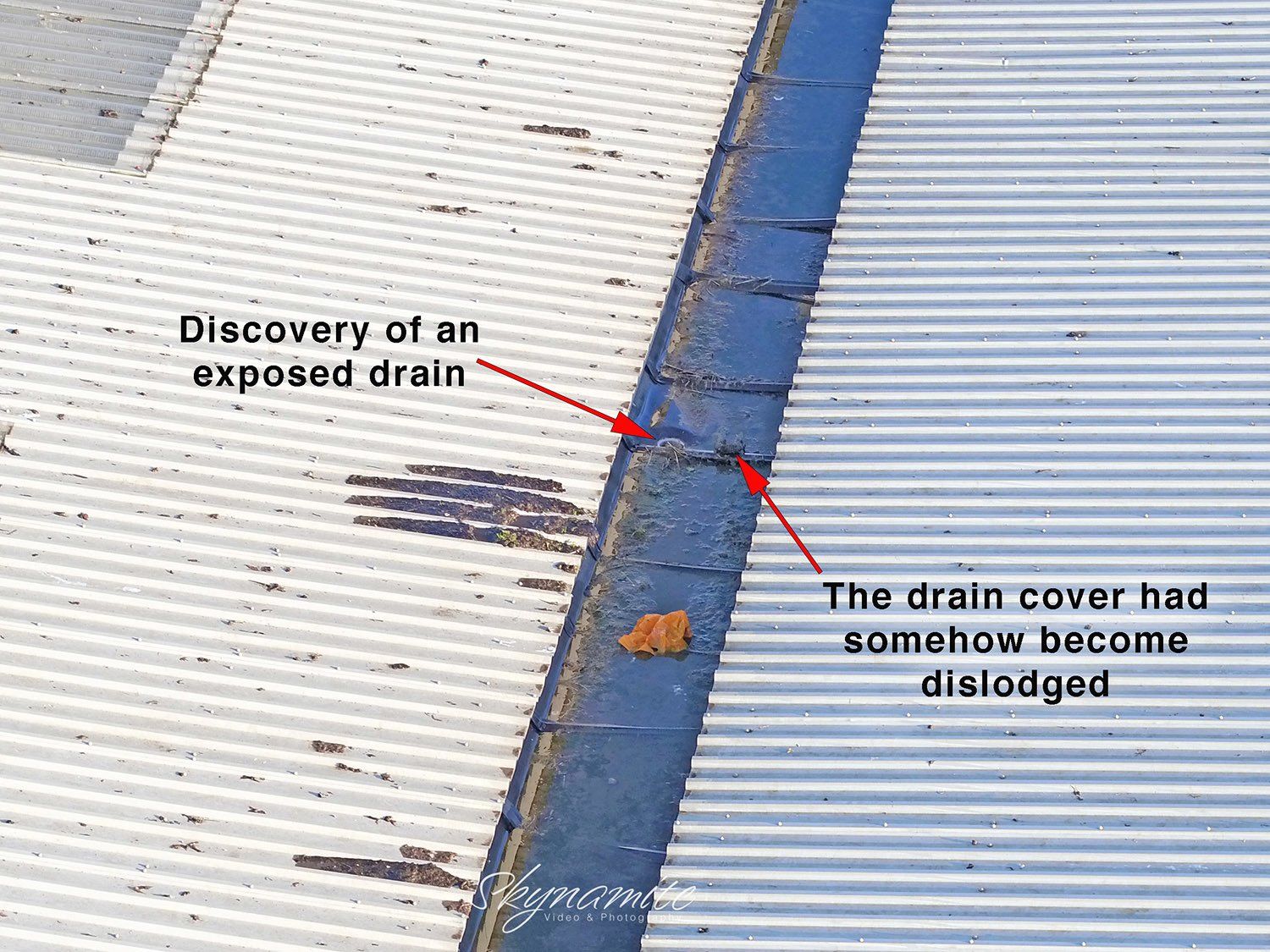 An aerial inspection picture of central roof gutter with an exposed drain