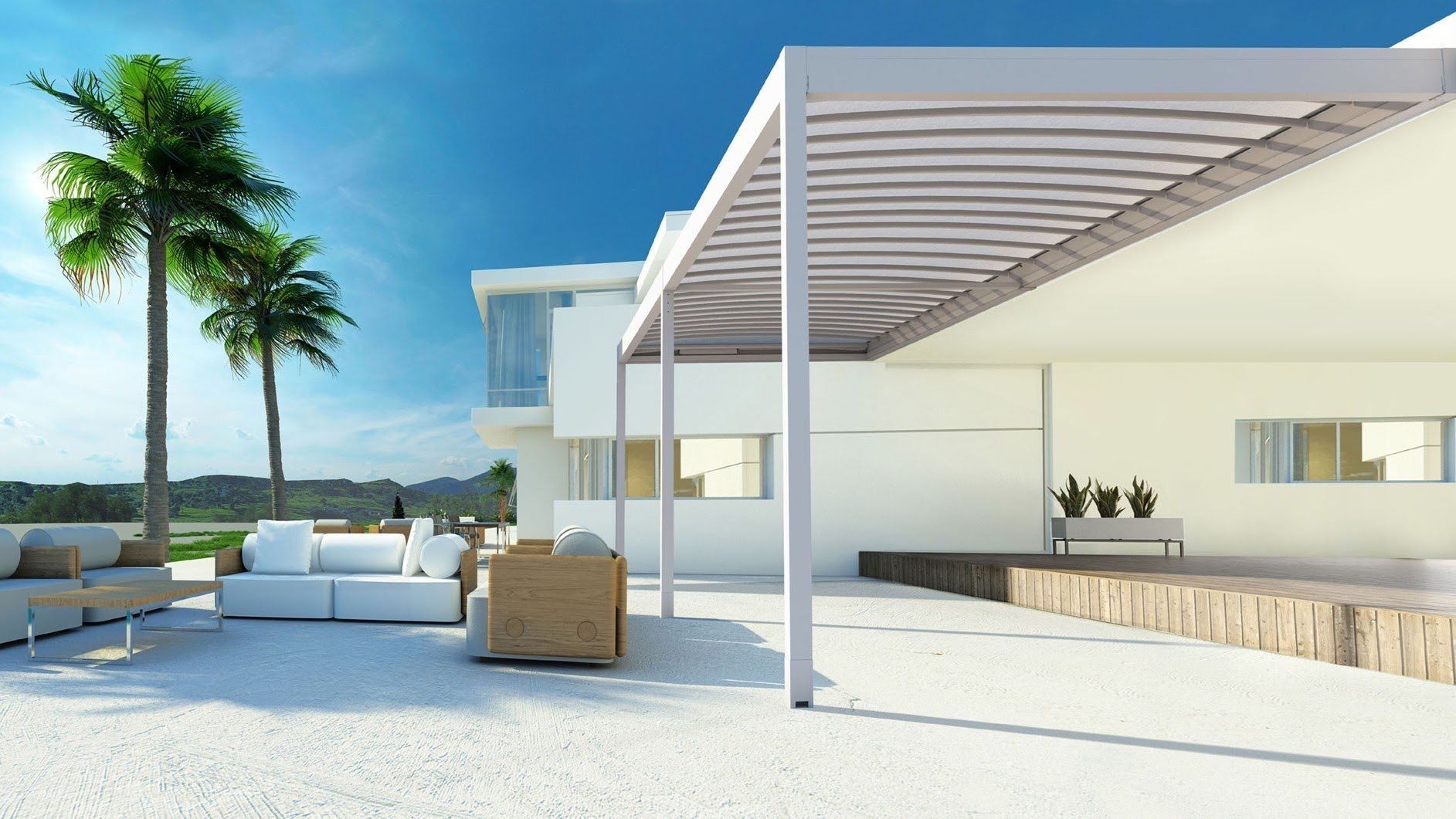 Una casa bianca con pergolato e palme