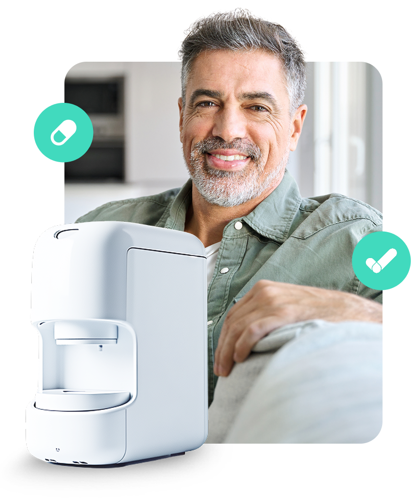 Man smiling next to a white medication dispenser; turquoise pill and checkmark icons.