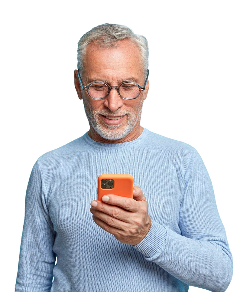 A man wearing glasses is holding a cell phone in his hand.