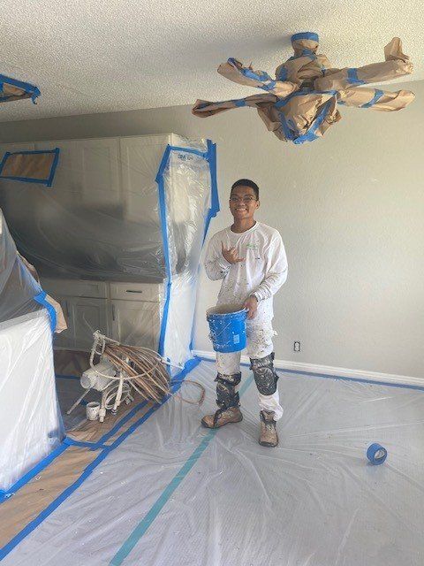 Man Holding A Paint Bucket | Oahu, HI | Clinton’s Painting