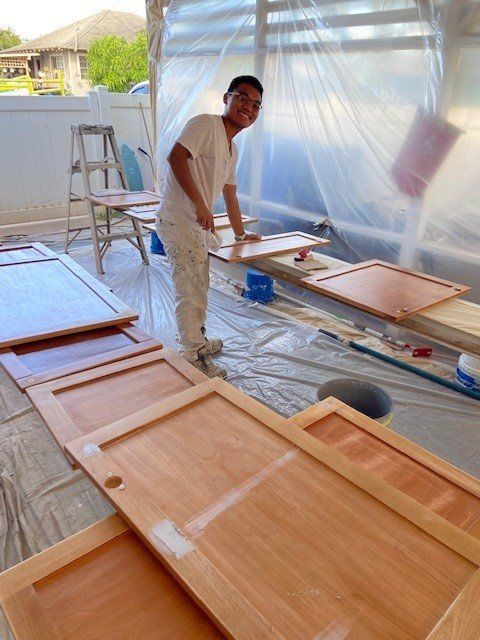 Man Painting The Woods For Cabinets | Oahu, HI | Clinton’s Painting