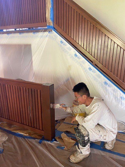 Man Painting Near The Stairs | Oahu, HI | Clinton’s Painting