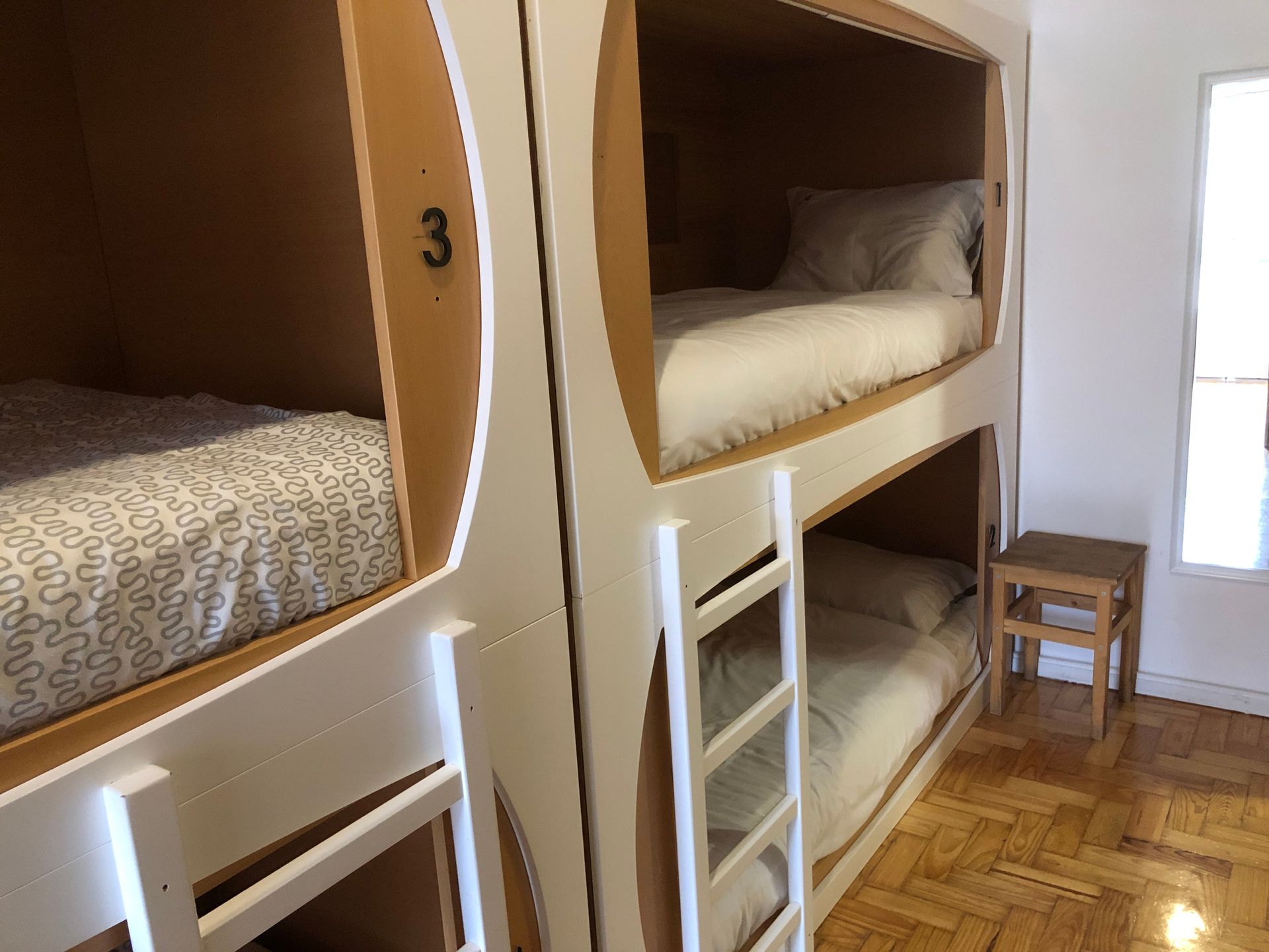 A bunk bed with the number 3 on it
