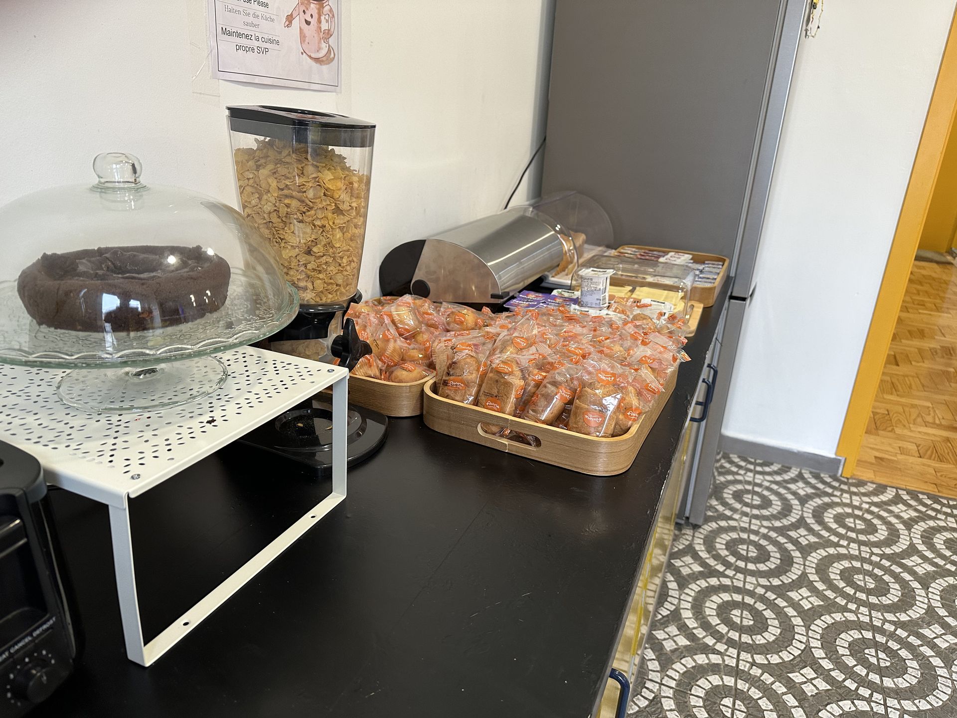 A kitchen counter with a cake on top of it.