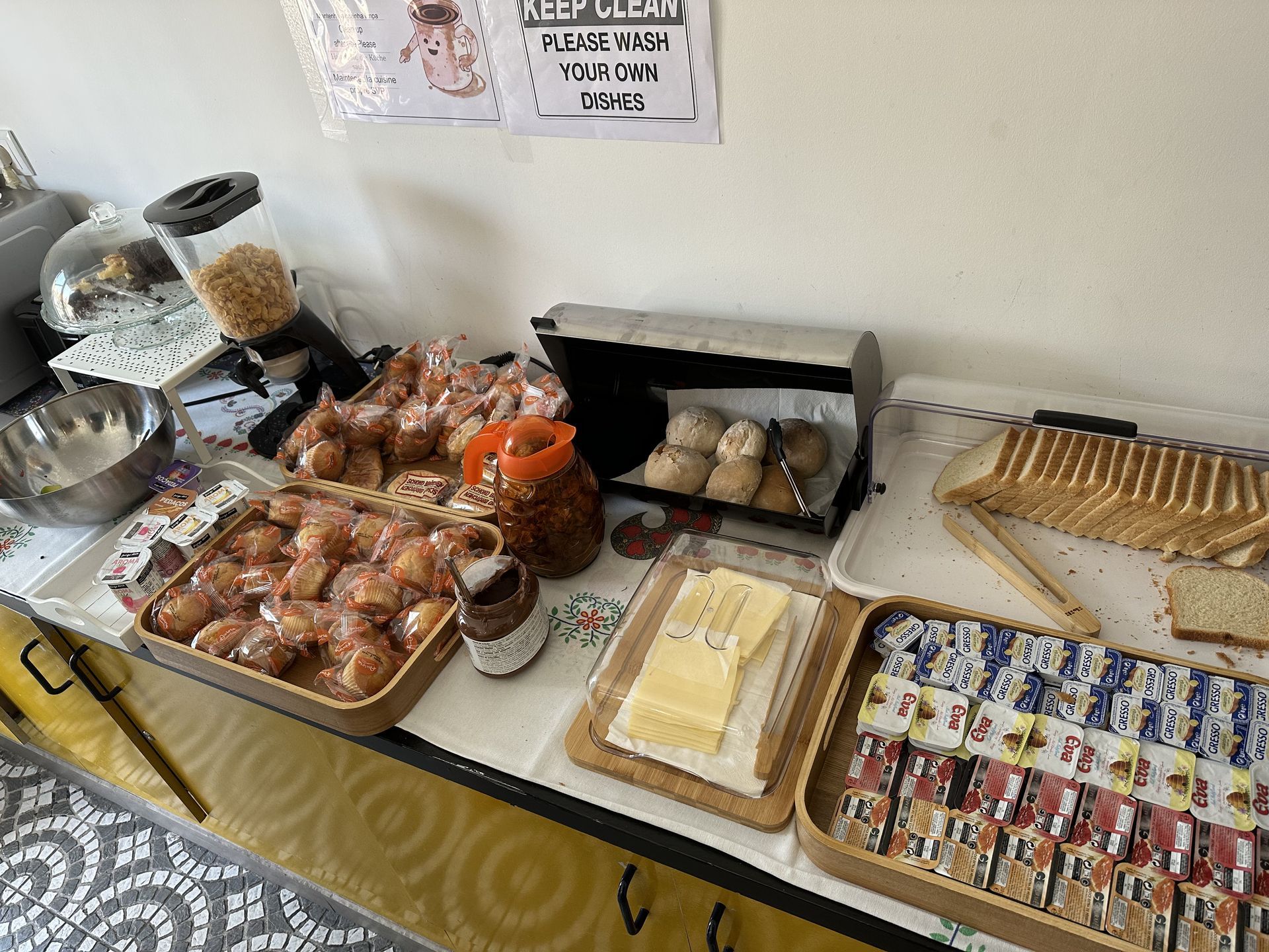 A buffet table with a variety of food on it.