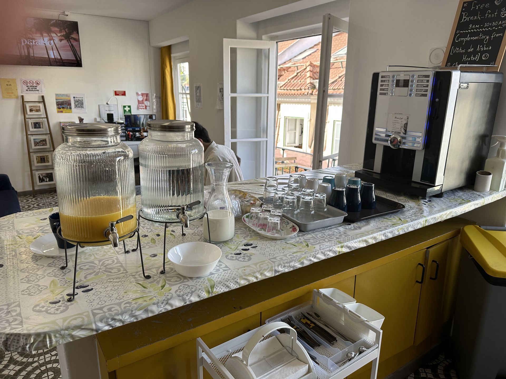 A bar with a lot of drinks and glasses on it.