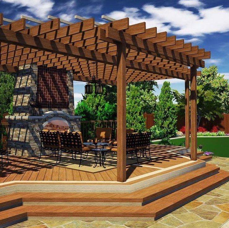 Wooden deck with a wooden pergola providing shade for the deck.  The patio around the deck has stamped concrete.