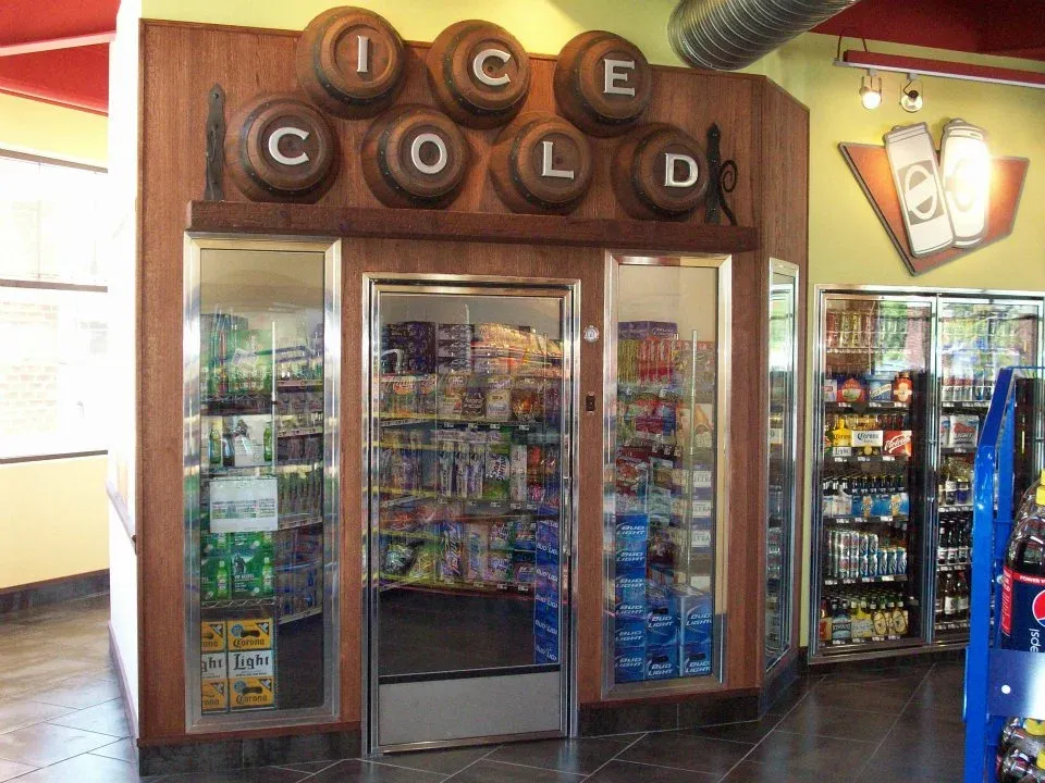 c-store-beer-cave-cooler-with-glass-doors-and-wood-sign