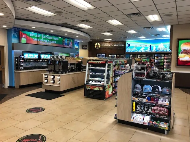 c-store-equipment-with-soda-machines-open-display-coolers-and-merchandise