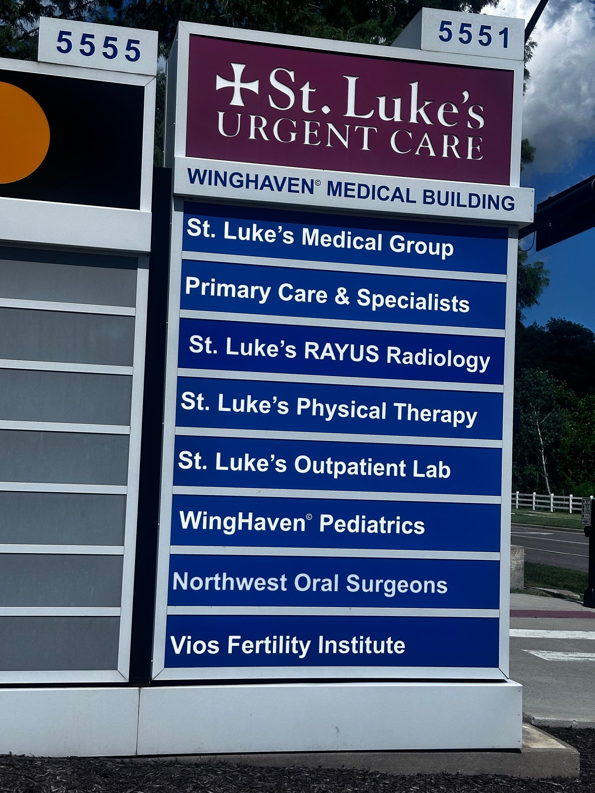 Sign for St. Luke's Medical Group and Winghaven Medical Building, listing medical services. 
