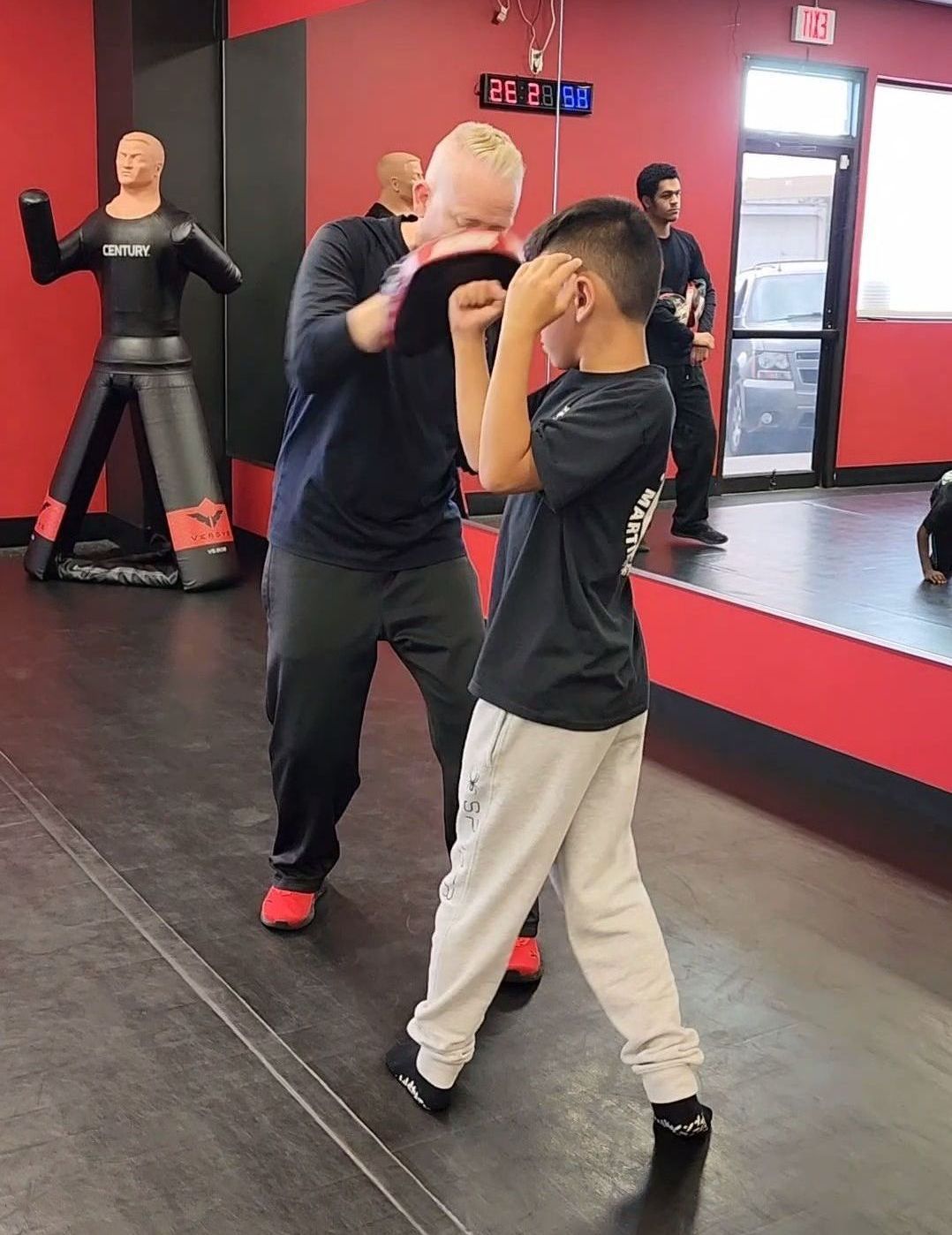a boy practicing krav maga