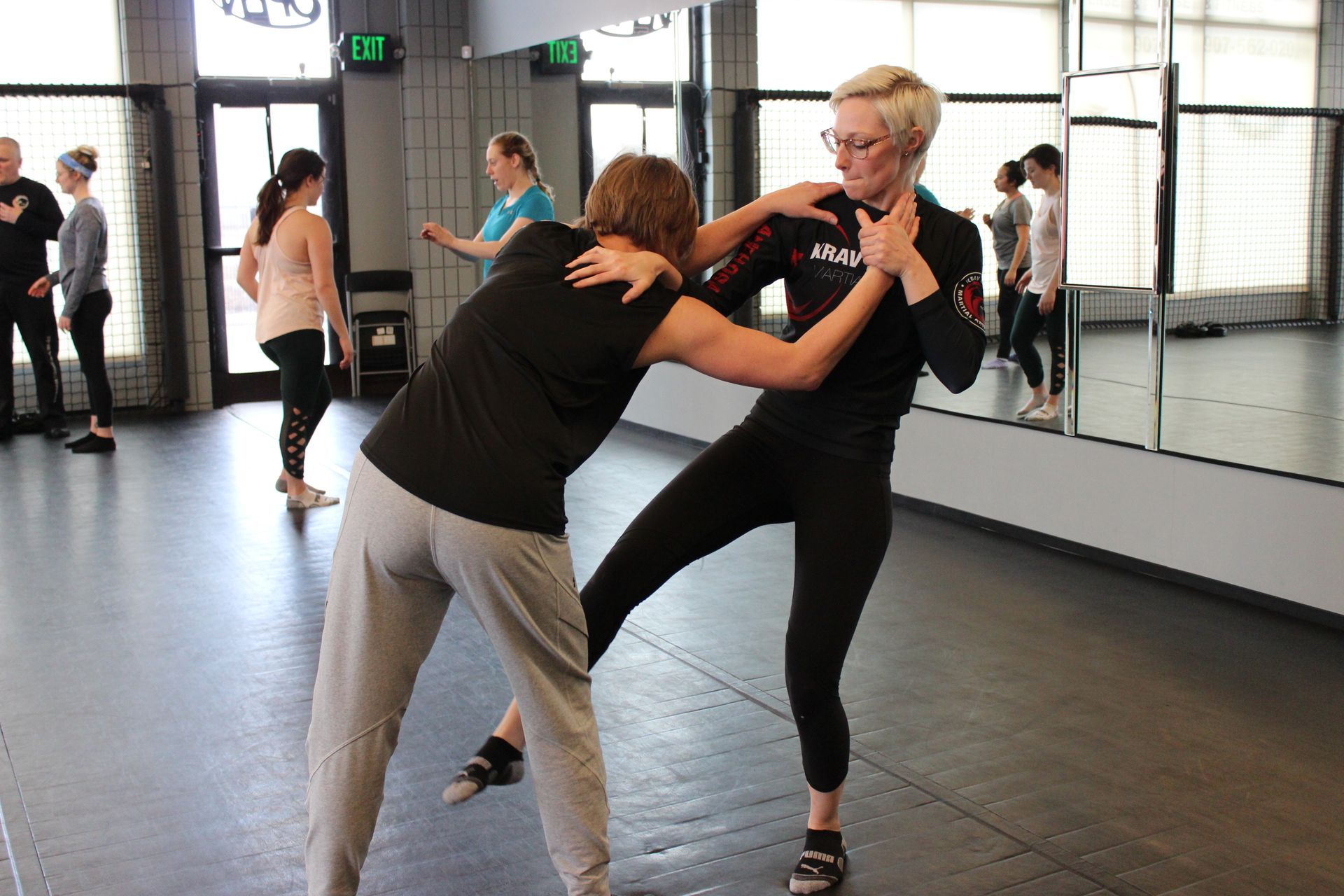 a women practicing krav maga martial arts