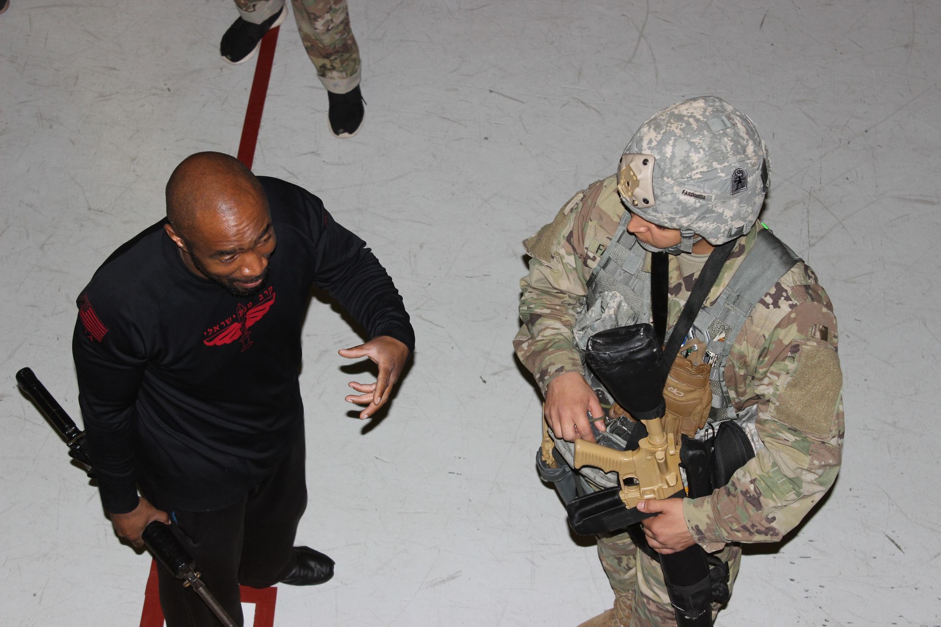 Military men training with krav maga instructor