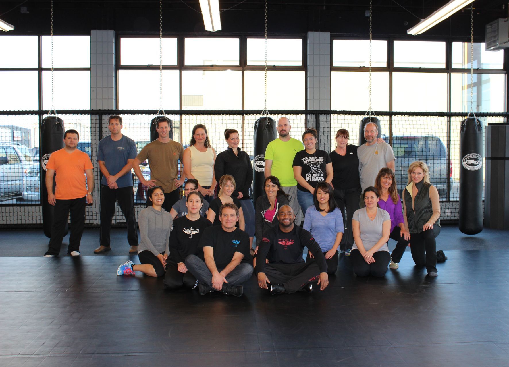 A group of people smiling after learning self defense
