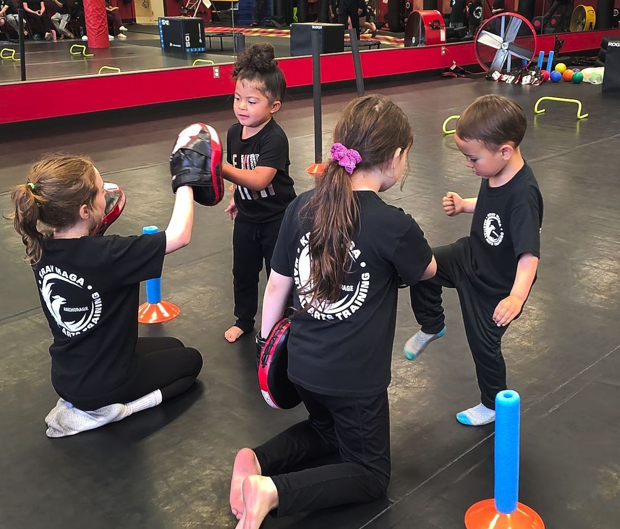 children helping and learning krav maga