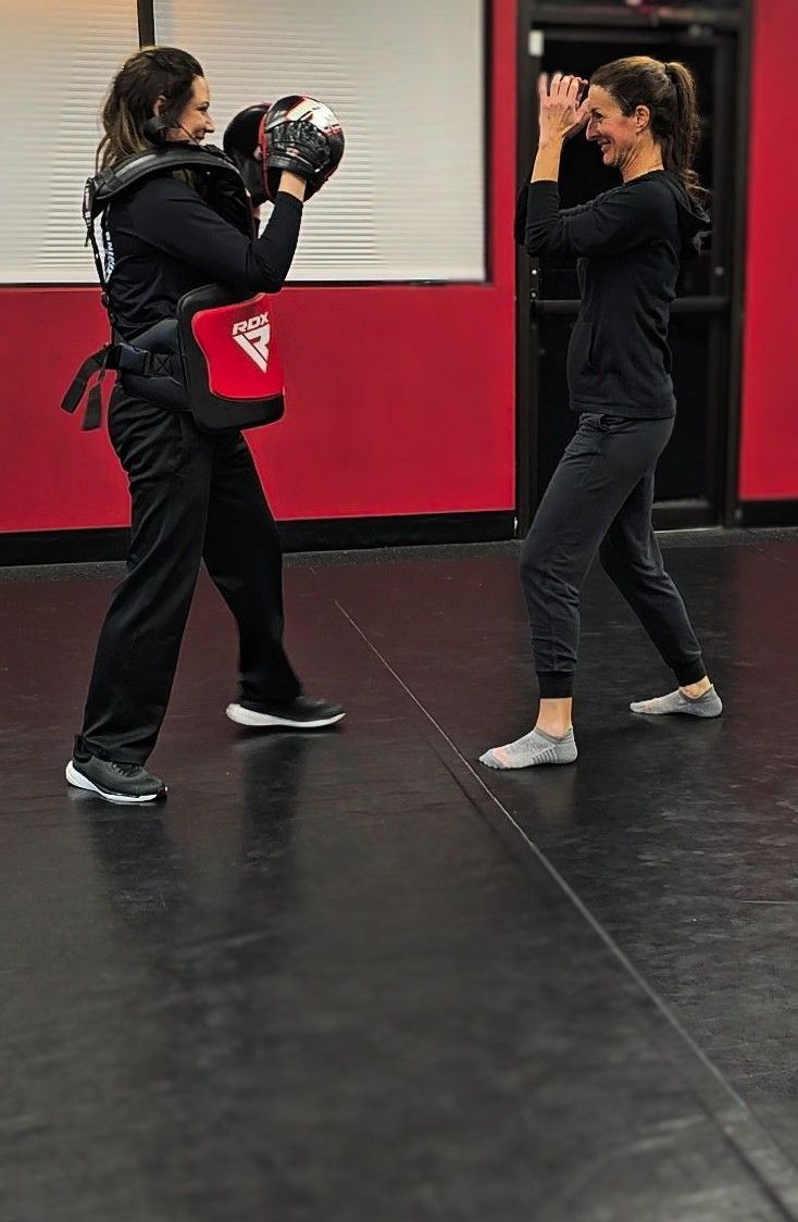 Women training self defense together L.A.C.E. Course