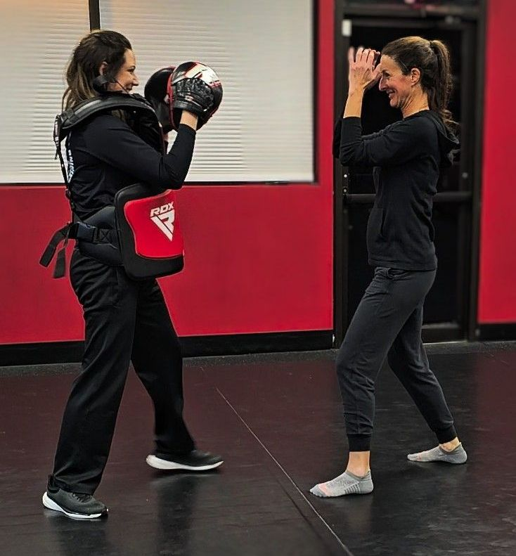 Women training self defense together L.A.C.E. Course