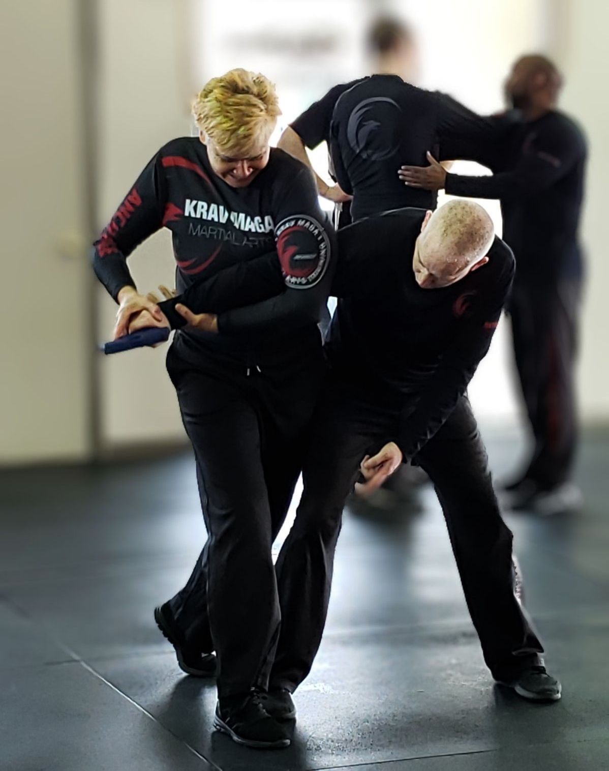 Woman disarming attacker