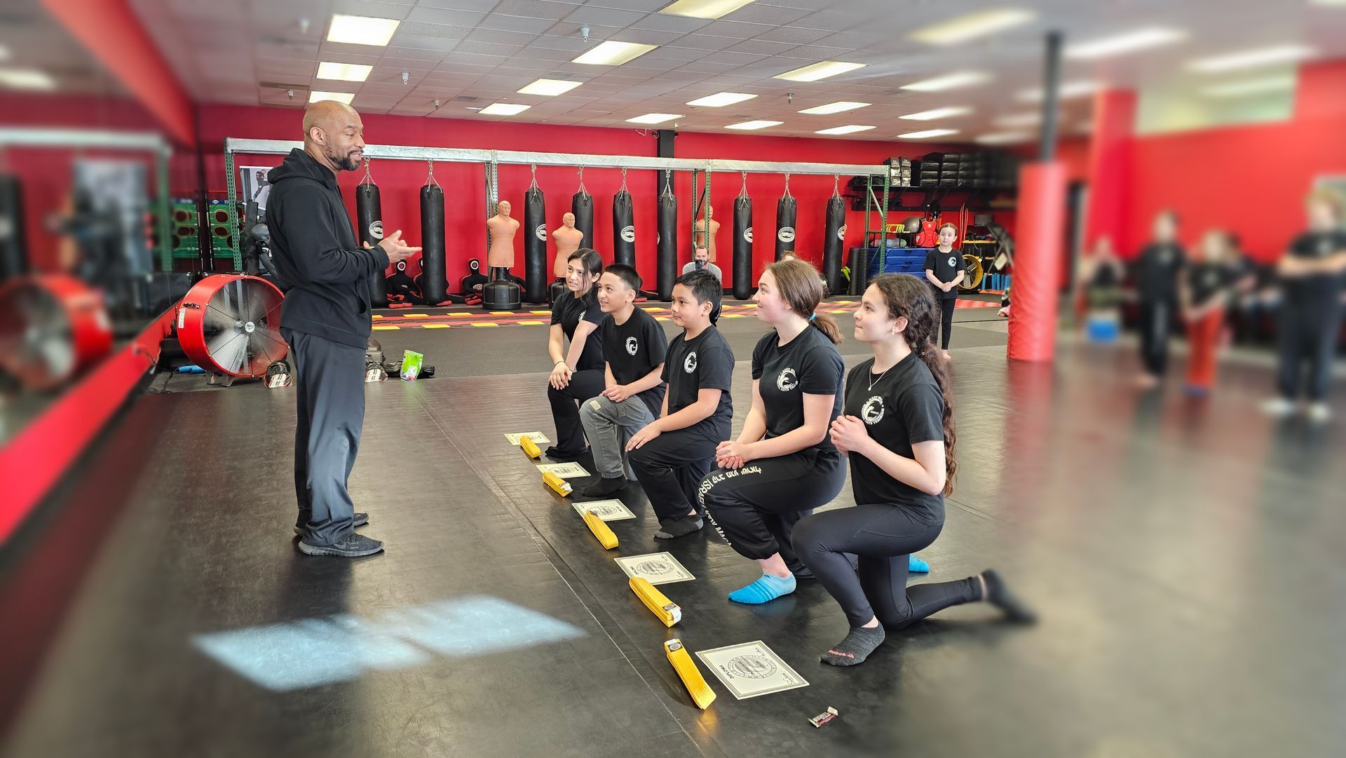 girls and boys passing their yellow belt in krav maga