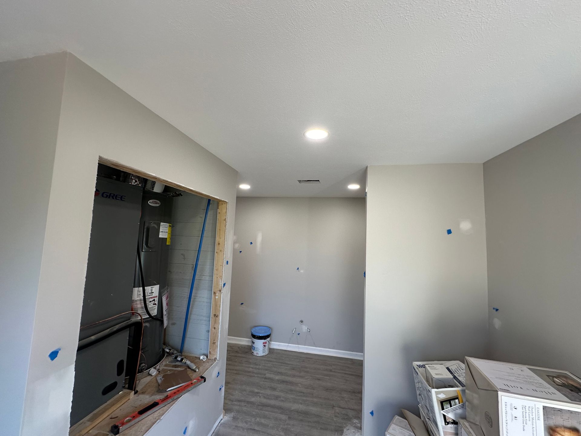 A room that is being remodeled with a window in the wall.