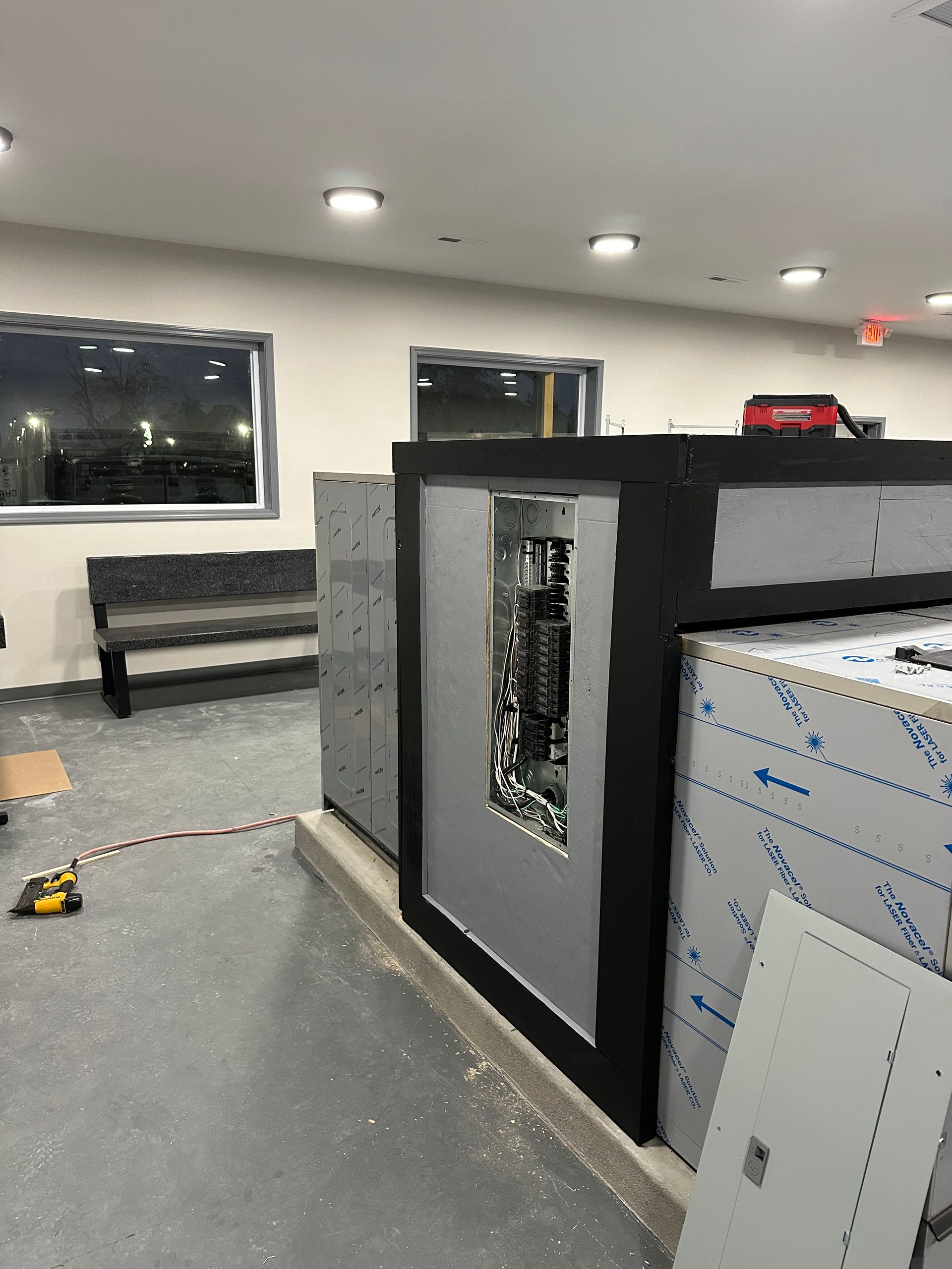 A room with a couch and a box on the floor