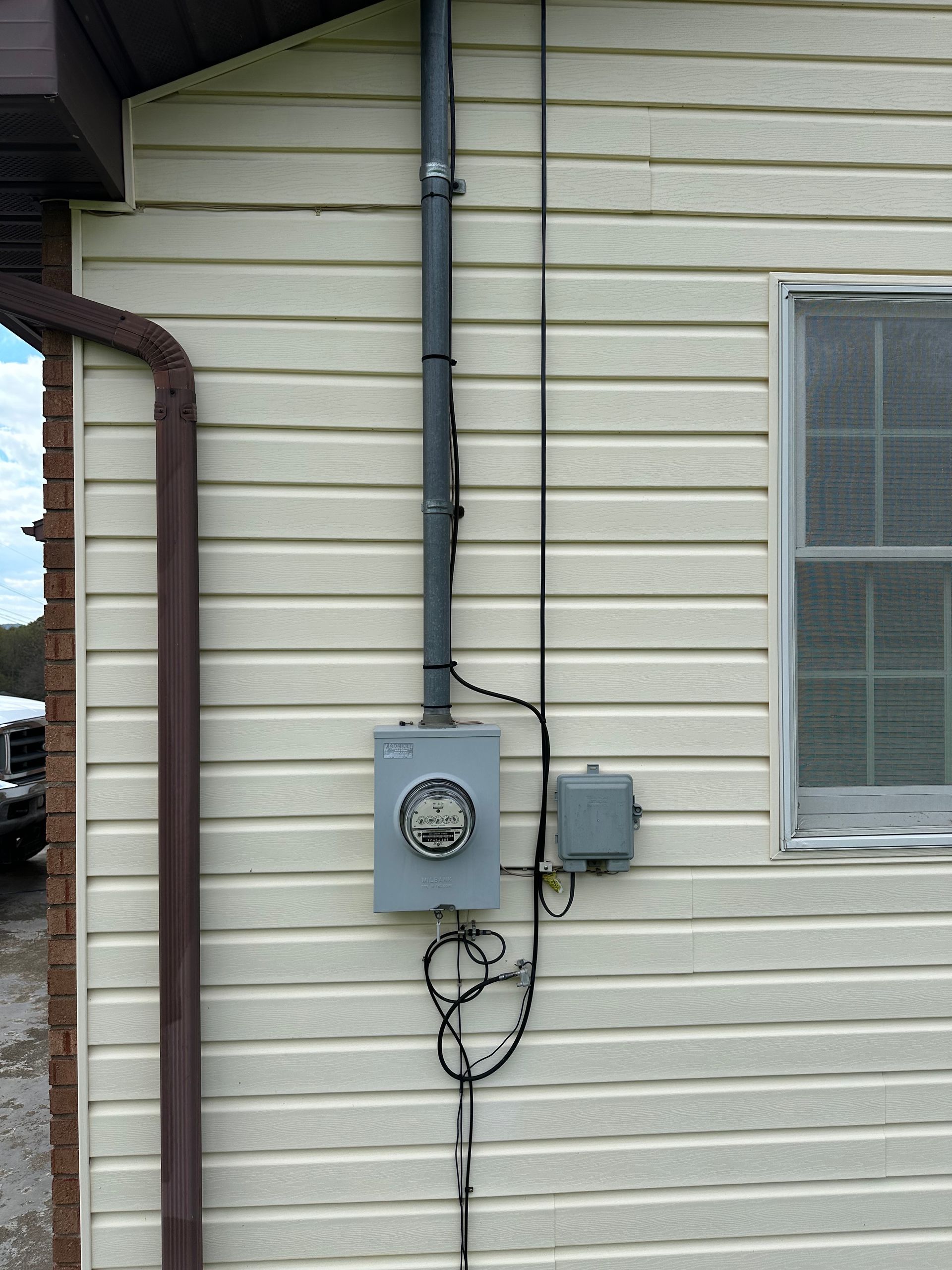 A house with a meter on the side of it