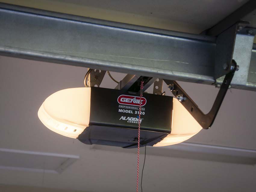 A garage door opener is hanging from the ceiling