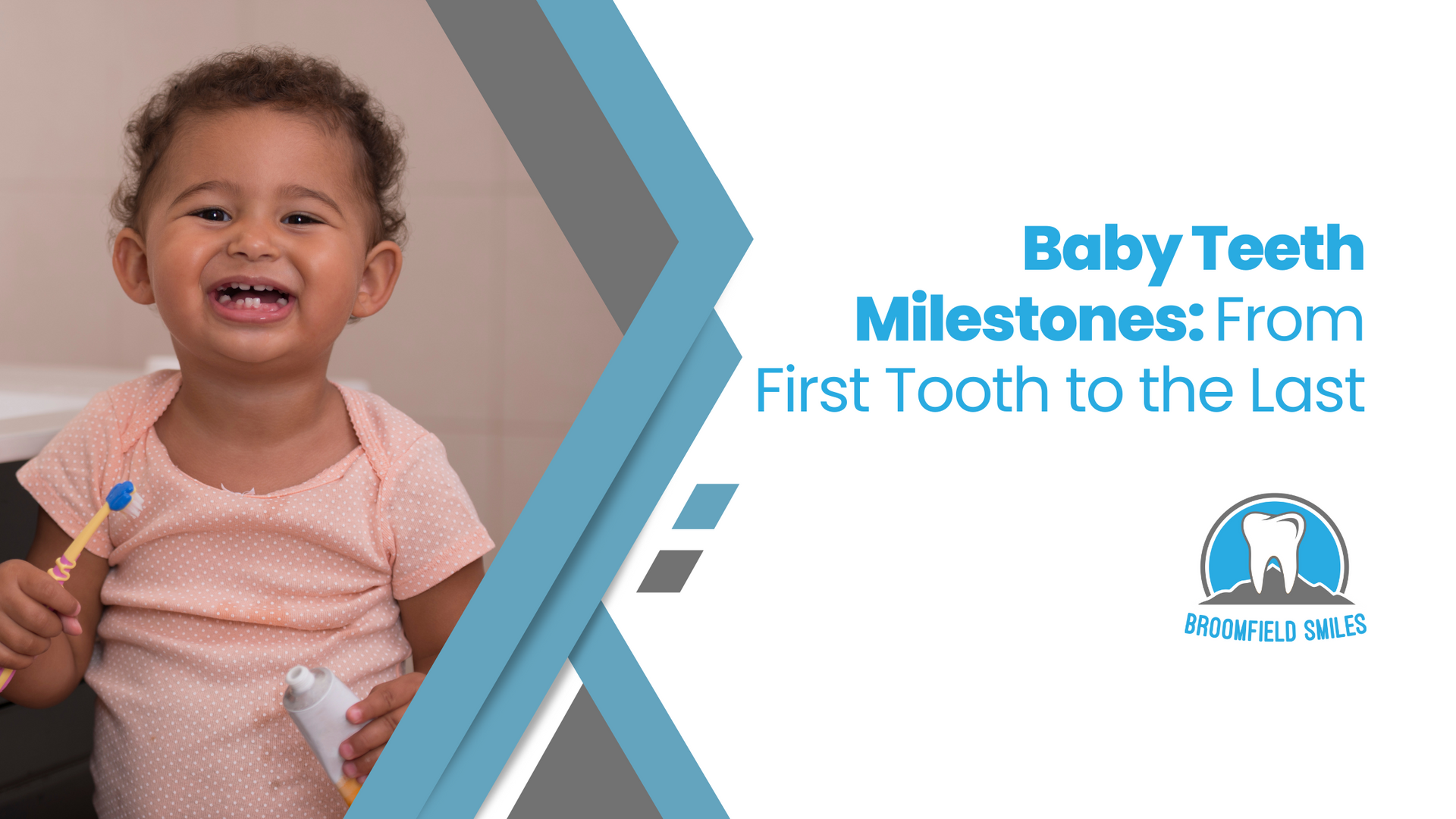 A baby is holding a toothbrush and smiling.