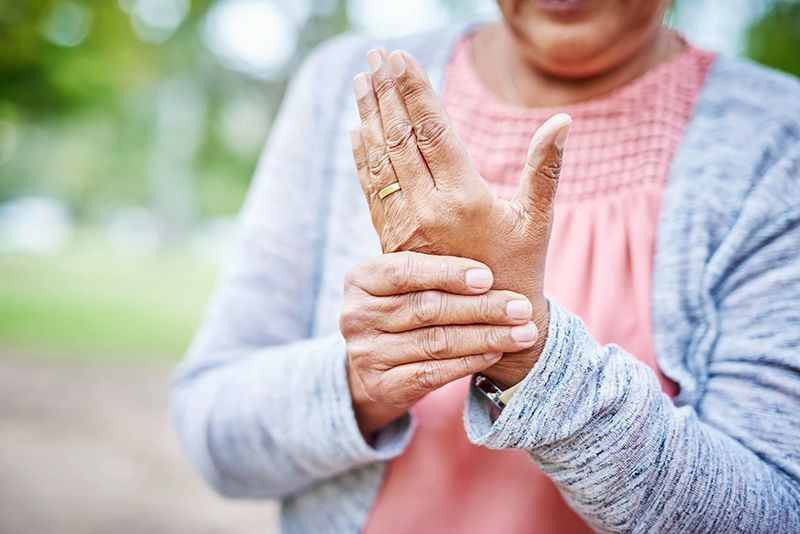 Arthritis-woman holding her hand. Stem Cells Philadelphia offers less invasive treatments such as injections of platelet-rich plasma (PRP) and stem cell therapy to treat arthritis.