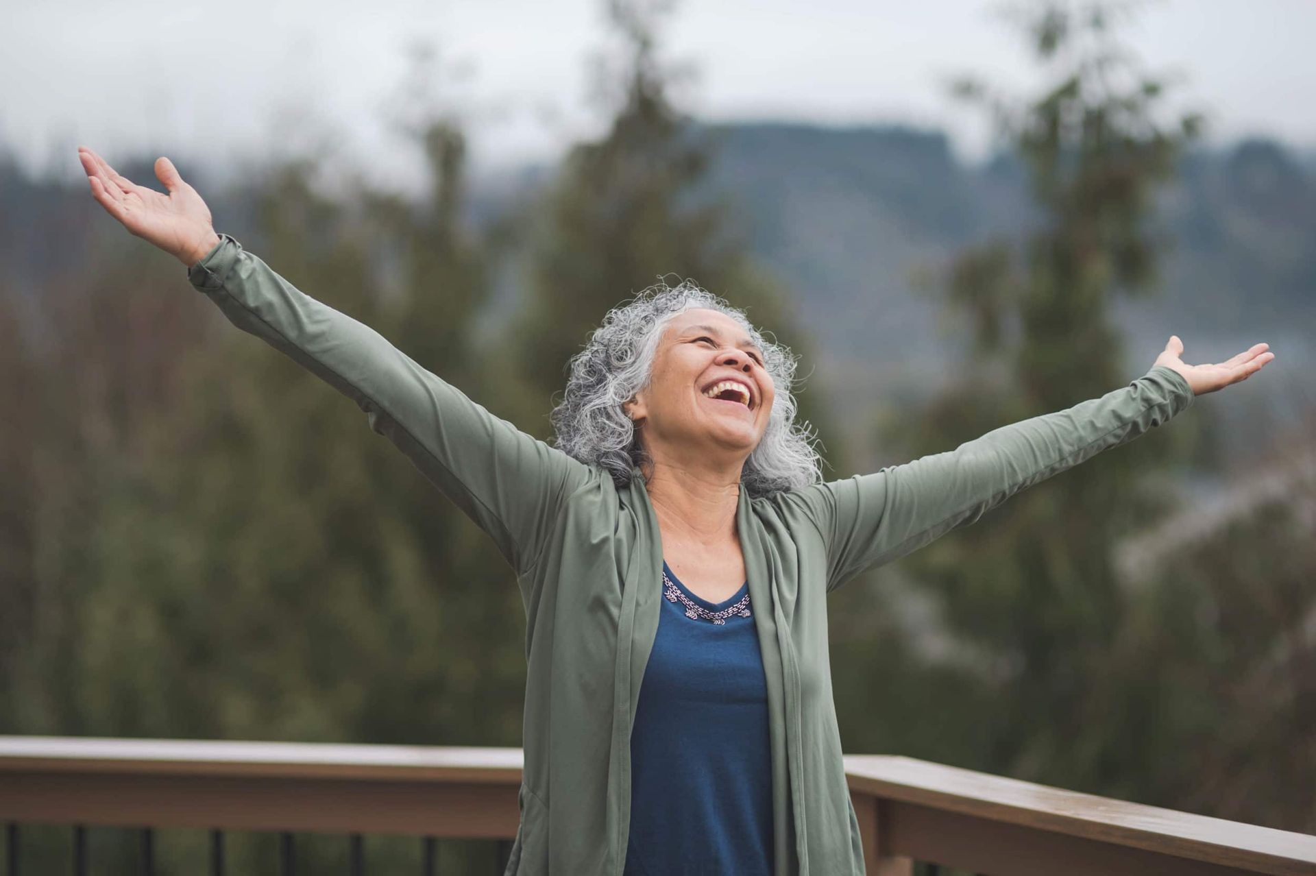 A woman with her arms outstretched - Regenerative therapy can help with COPD, chronic knee, back, neck, hip, shoulder pain, osteoarthritis, arthritis, and other joint pain.
