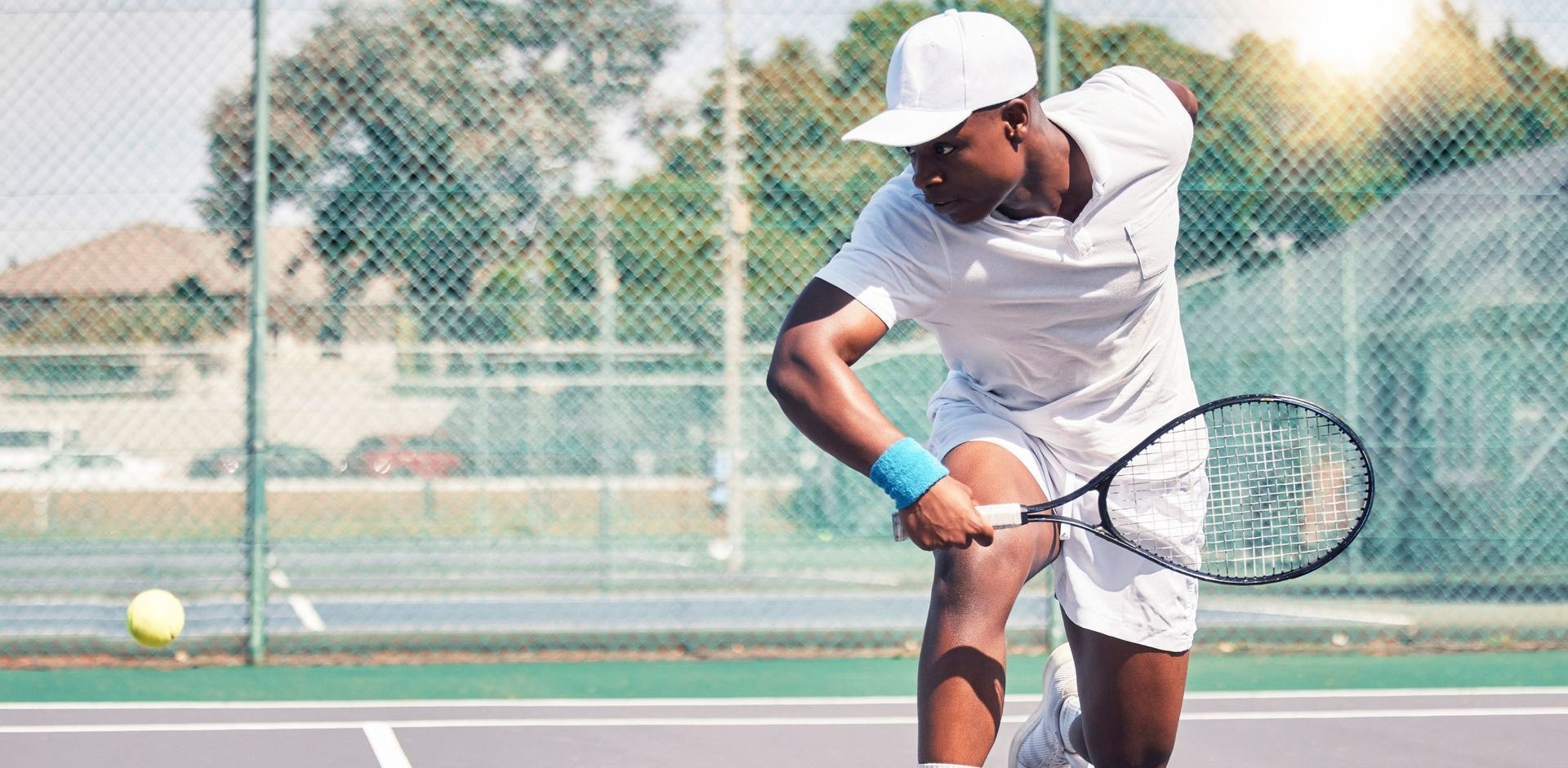 Man is playing tennis on a tennis court. Nonsurgical regenerative medicine procedures are providing relief for people with chronic shoulder pain.