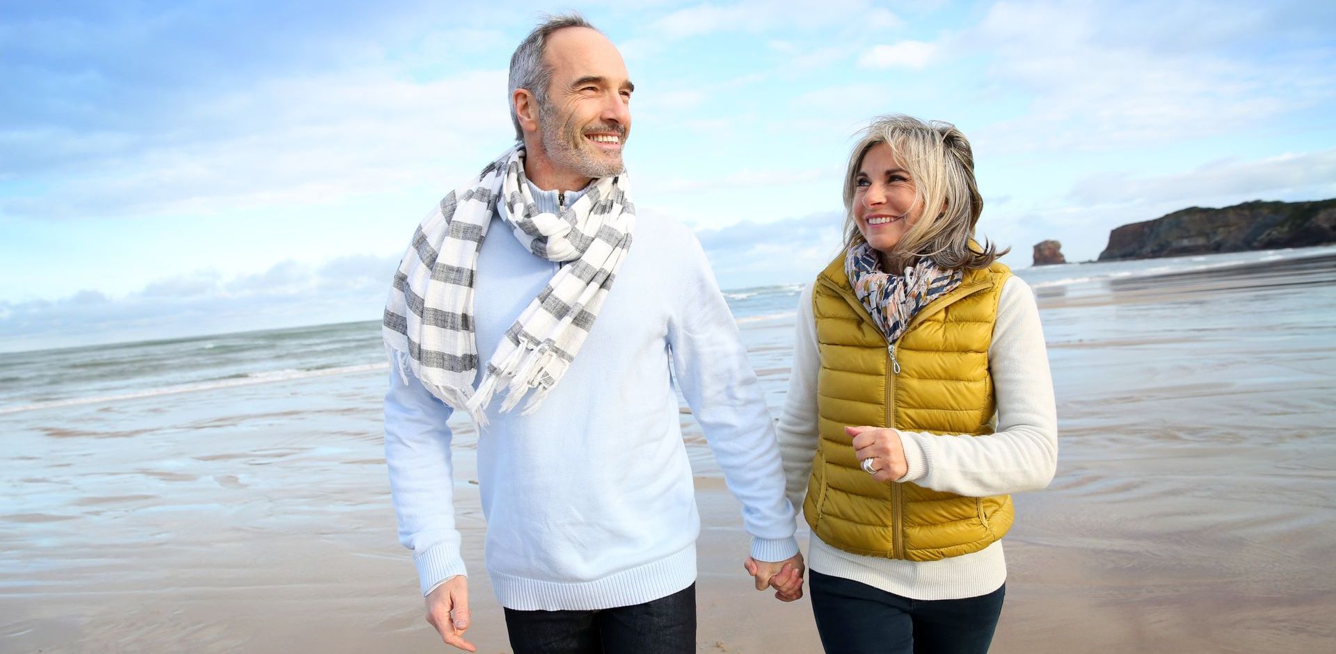 Man and woman are walking on the beach. PRP injectables use your own platelets to repair and restore your body’s own ability to grow hair. Stop covering up your hair loss and fully reverse it under the care of our expert medical team. Get hair growth treatments right here in our Villanova medical suite.