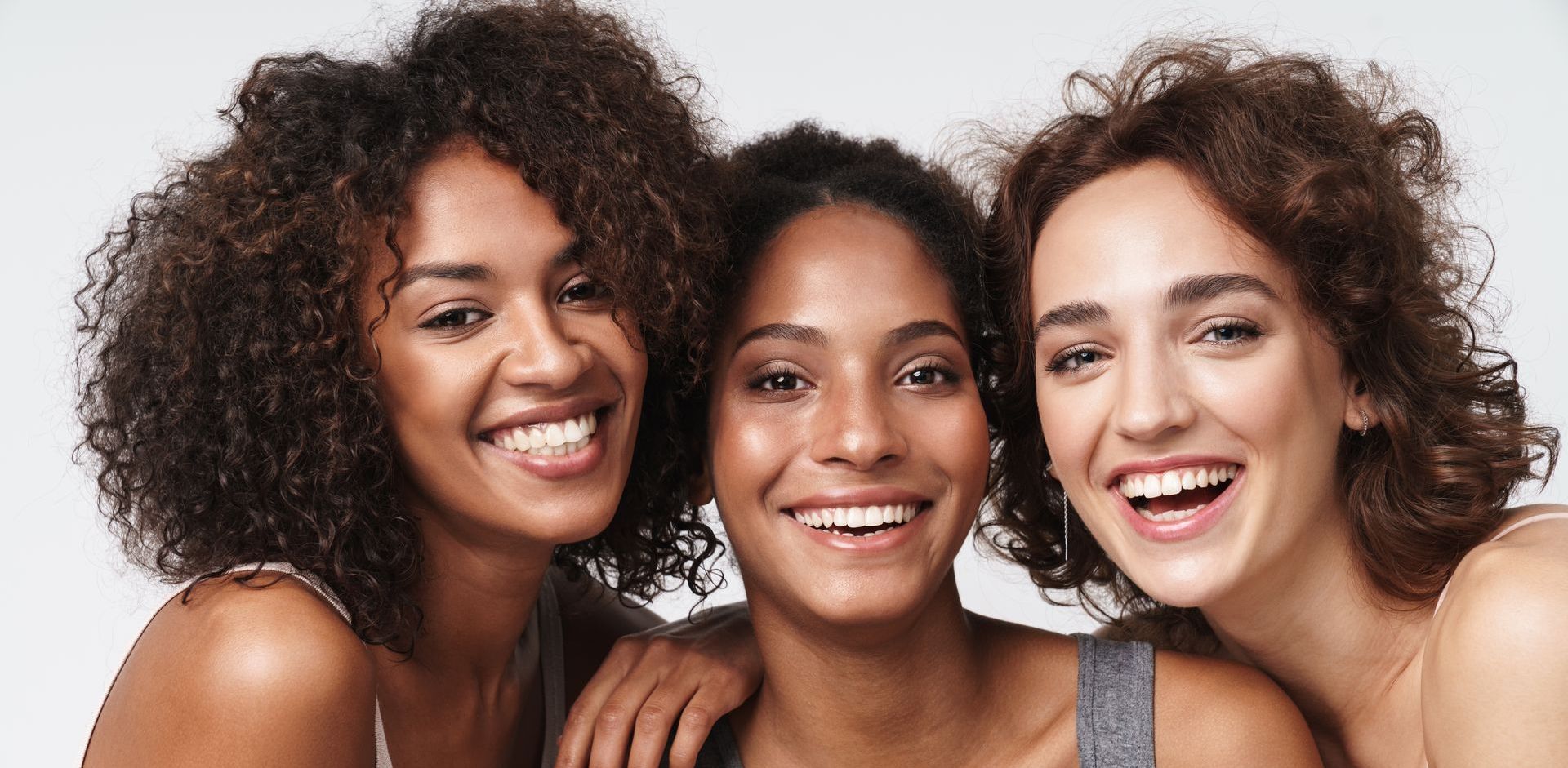 Three women are posing for a picture. Refresh your look with facial aesthetic services. Choose from our selection of treatments like Botox, facial fillers, thread lifts.
