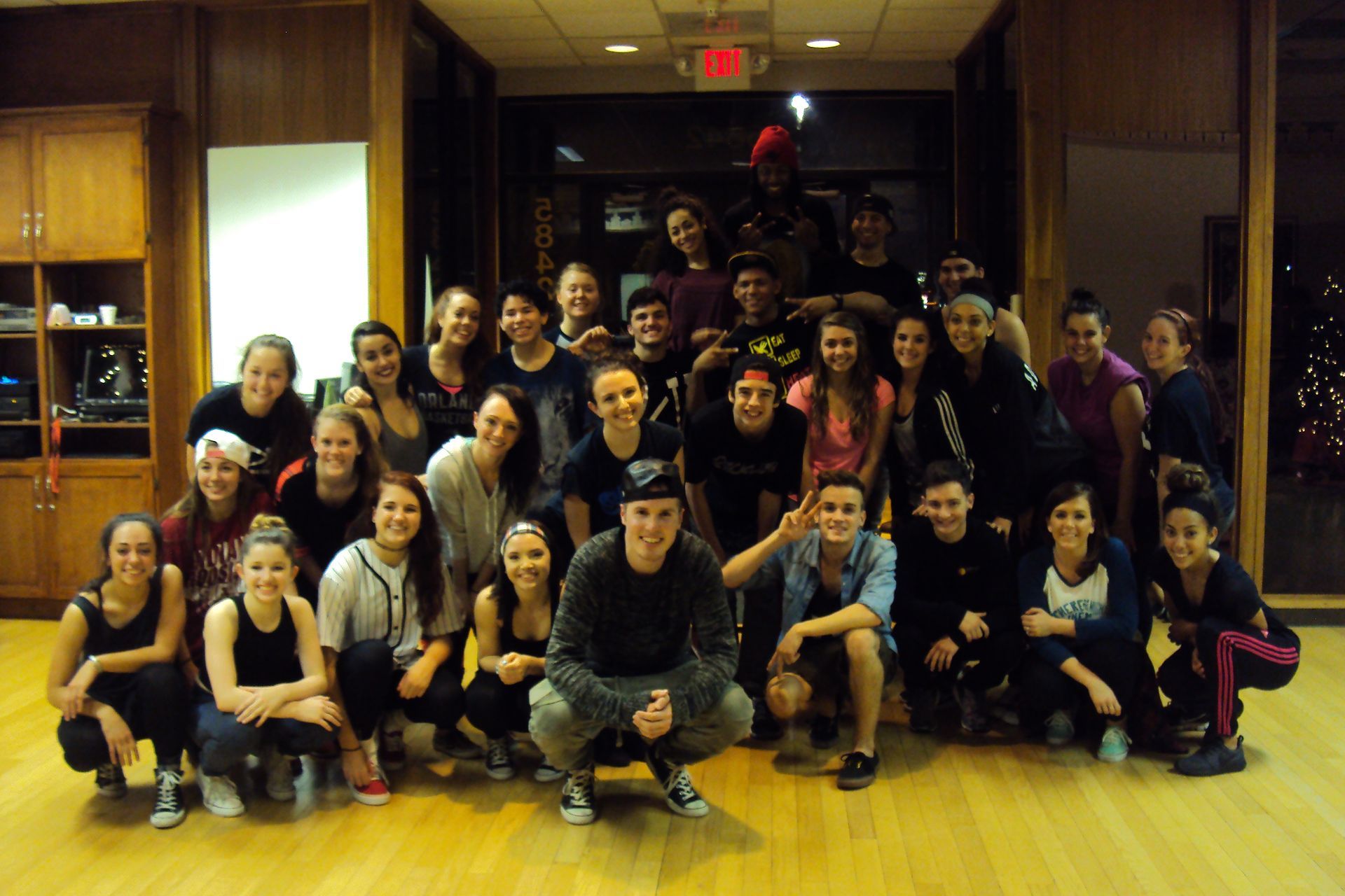 A group of people posing for a picture in a room
