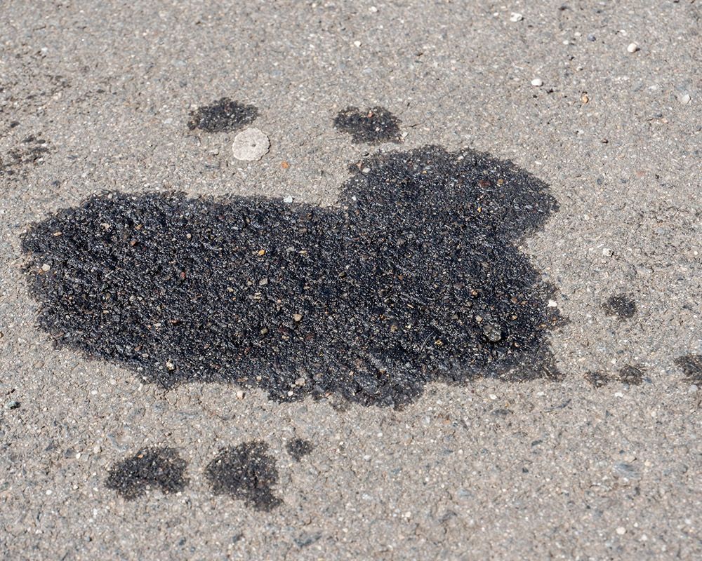 Oil Spot on Asphalt Road – Oahu, HI – Oahu Sealcoating & Paving