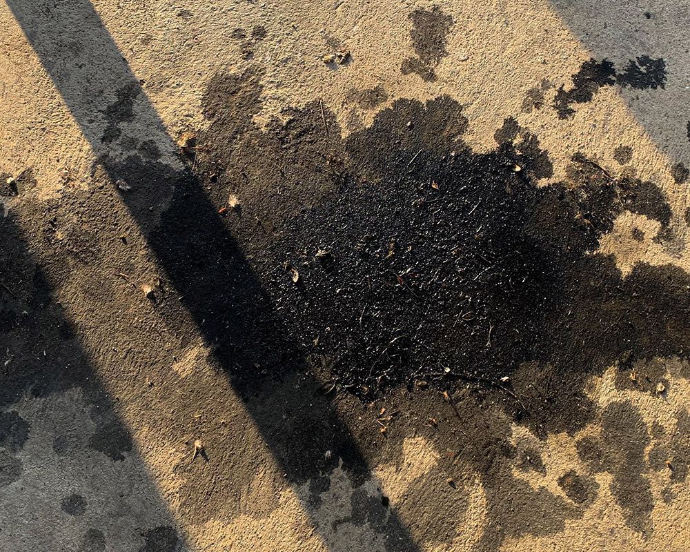 Oil Spot on Road Markings – Oahu, HI – Oahu Sealcoating & Paving