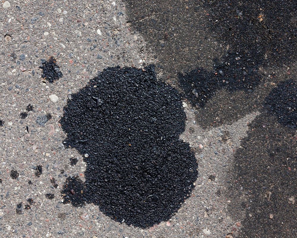 Oil Stain on Driveway – Oahu, HI – Oahu Sealcoating & Paving