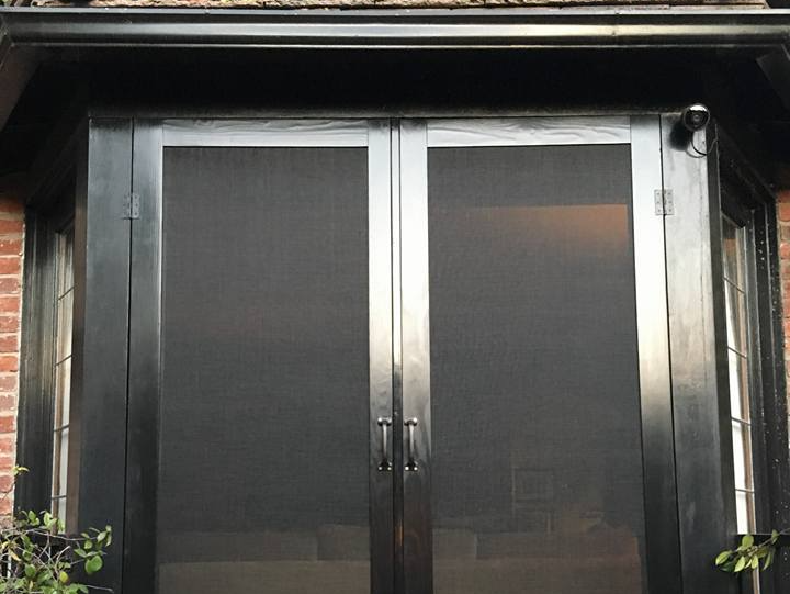 Newly installed black screen door