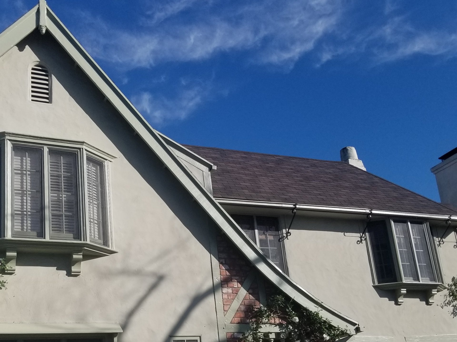 Newly installed window screens on a residential house