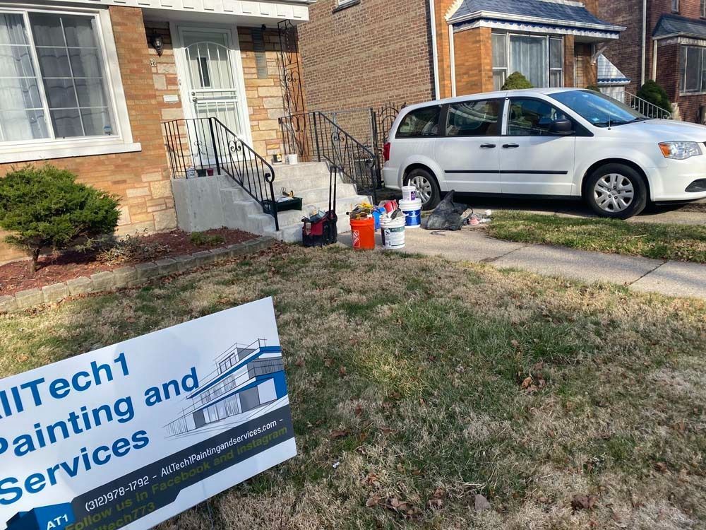 Exterior house painting services setup: van, paint cans, tools near front steps, and business sign.