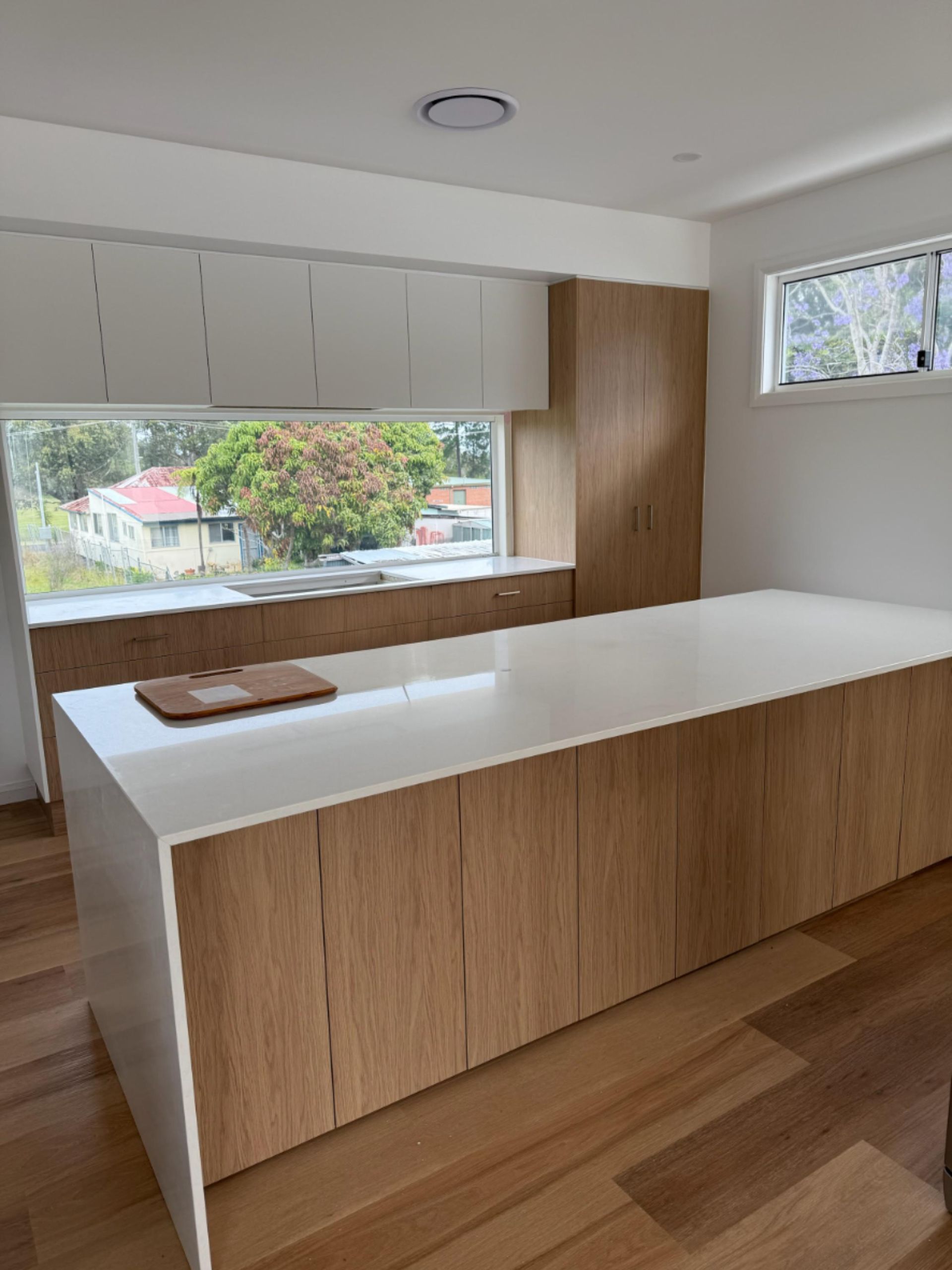 Modern Kitchen With Wooden Cabinets and Island, White Countertops — Gateway Manufacturing in Morisset, NSW