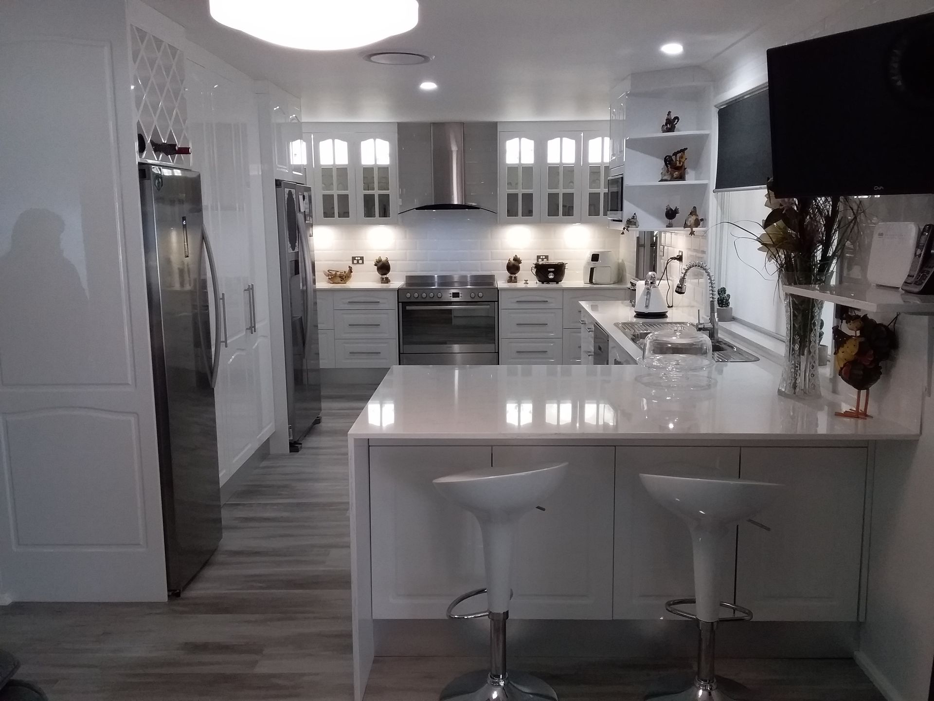 White Modern Kitchen With Island Seating, Stainless Steel Appliances — Gateway Manufacturing in Morisset, NSW