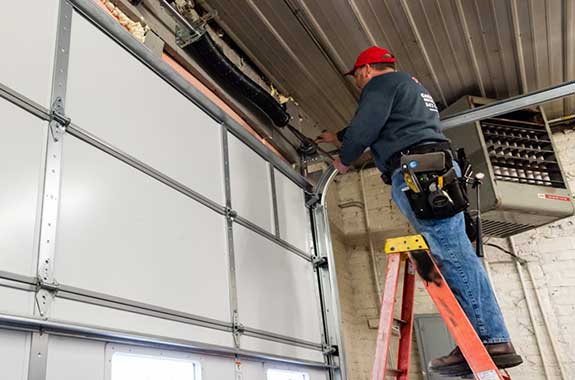 Worker Installing New Garage Door — Antioch, IL — Duke of Doors
