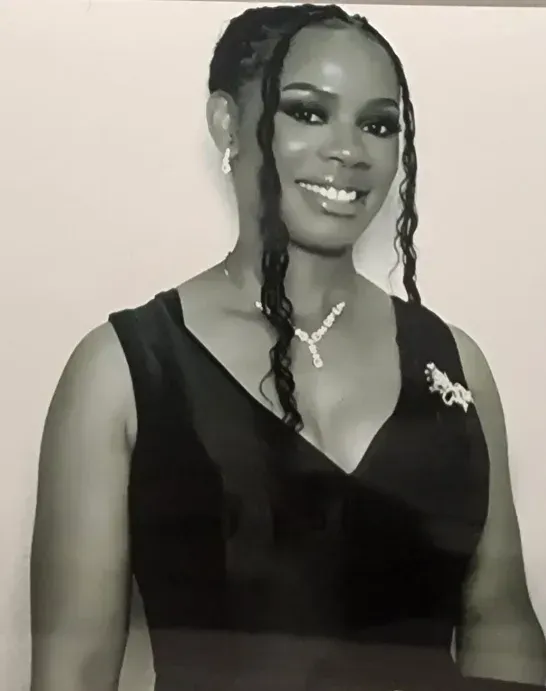 A woman in a white coat is examining a patient 's leg