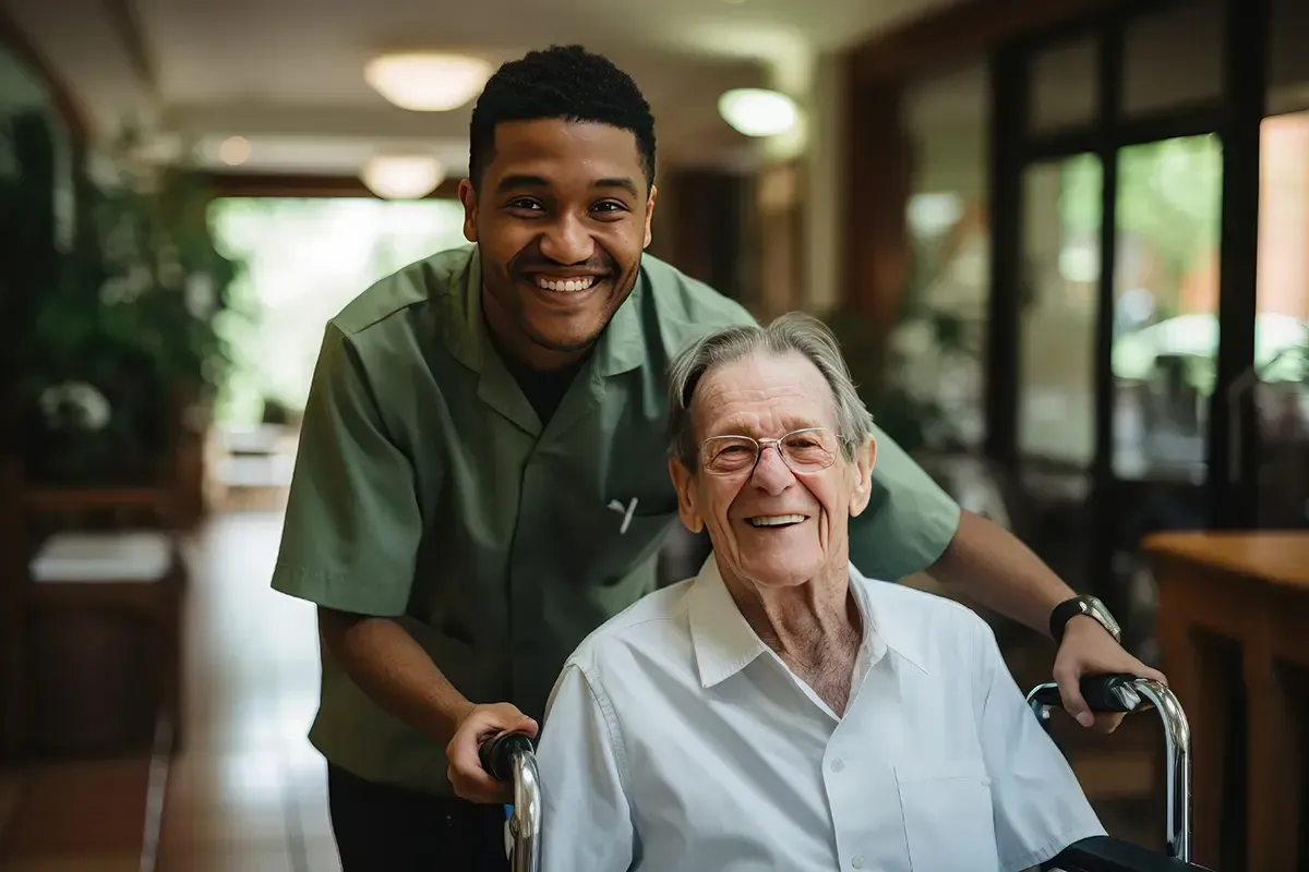 A male nurse is helping an older patient