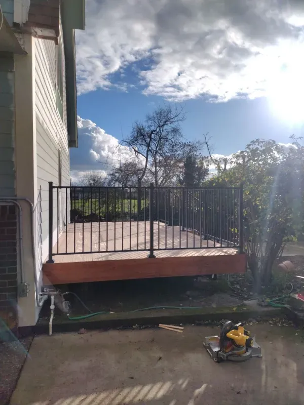 A deck is being built in the backyard of a house.